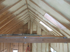 Insulation installed in an unfinished attic.